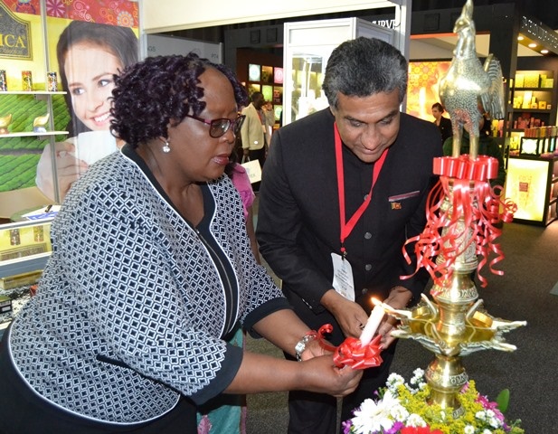 lighting_of_the_traditional_oil_lamp_by_the_chief_guest_of_SAITEX_Hon._Elizabeth_Thabethe_the_Deputy_Minister_of_Tourism_of_South_Africa