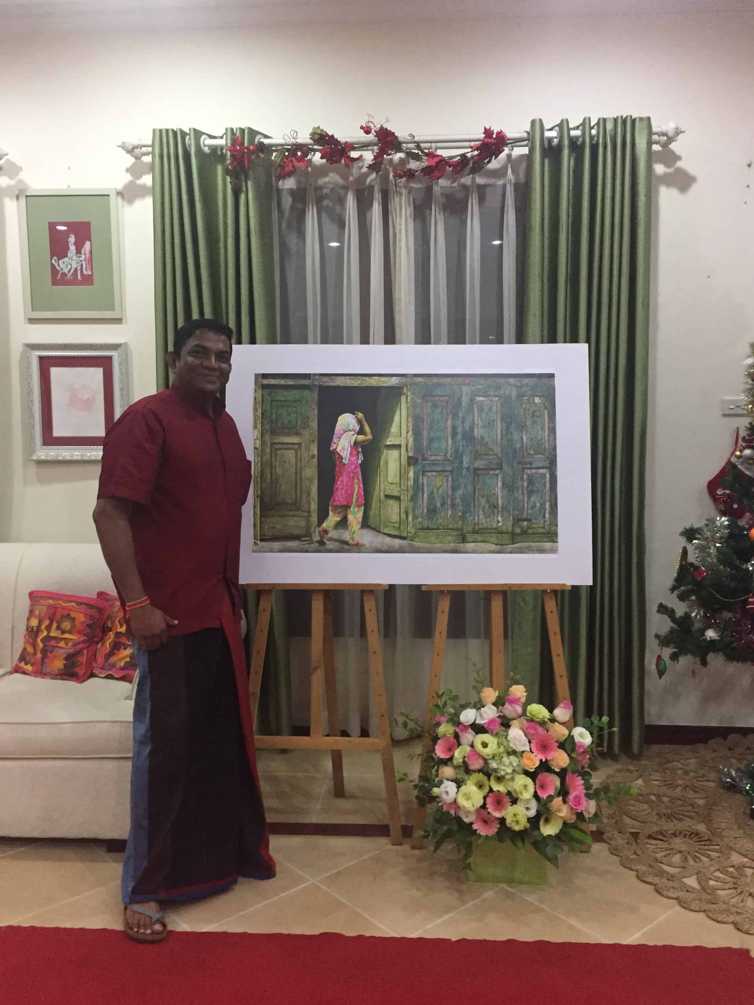 Image 5 - Vasantha with one of his art works