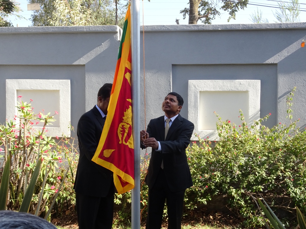 01 Ambassador hoisting the national flag